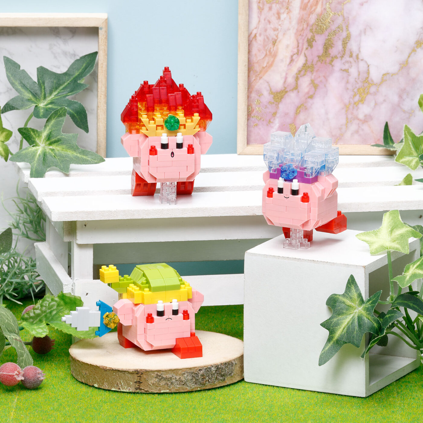 Kirby Fire, Kirby Ice and Kirby Sword nanoblock models displayed together on a shelf