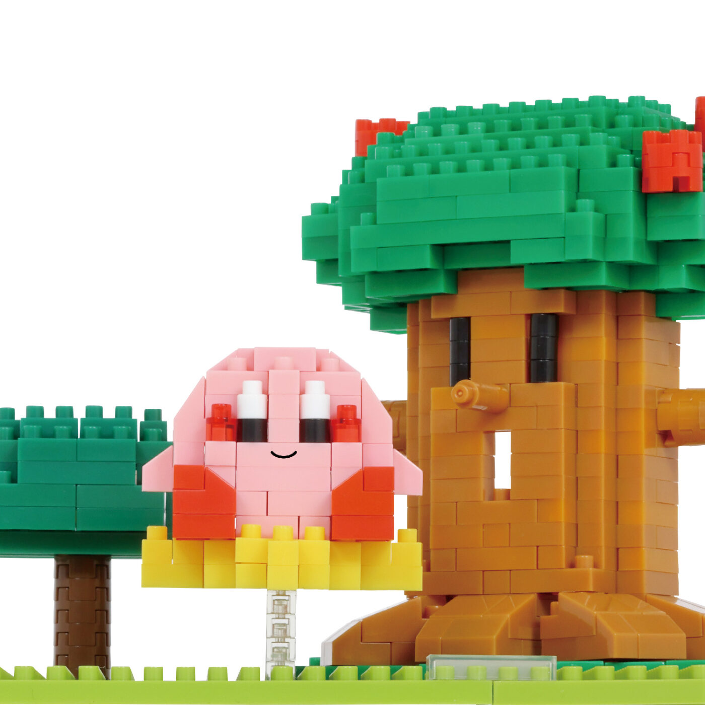 Close view of the Whispy Woods nanoblock tree showing overhanging leaf bricks and two shades of green