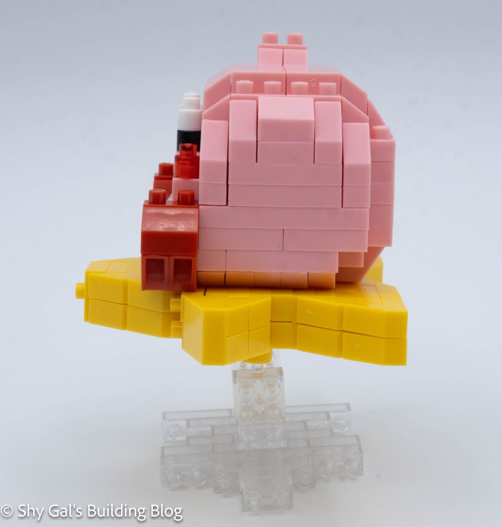 Independent reviewer's assembled Kirby nanoblock model showing how the Warp Star meets the clear stand's ball joint