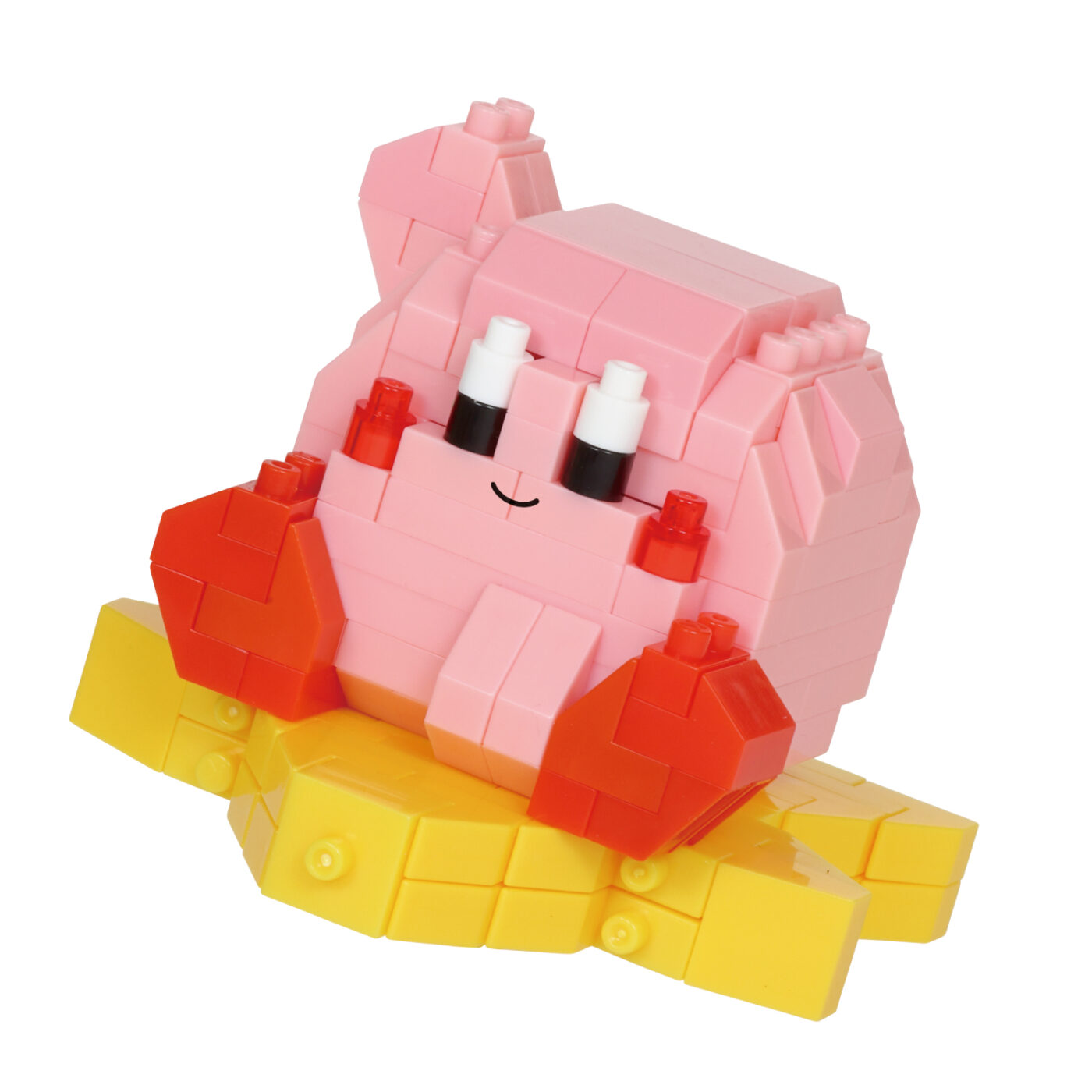 Assembled standard Kirby nanoblock model seated on a Warp Star