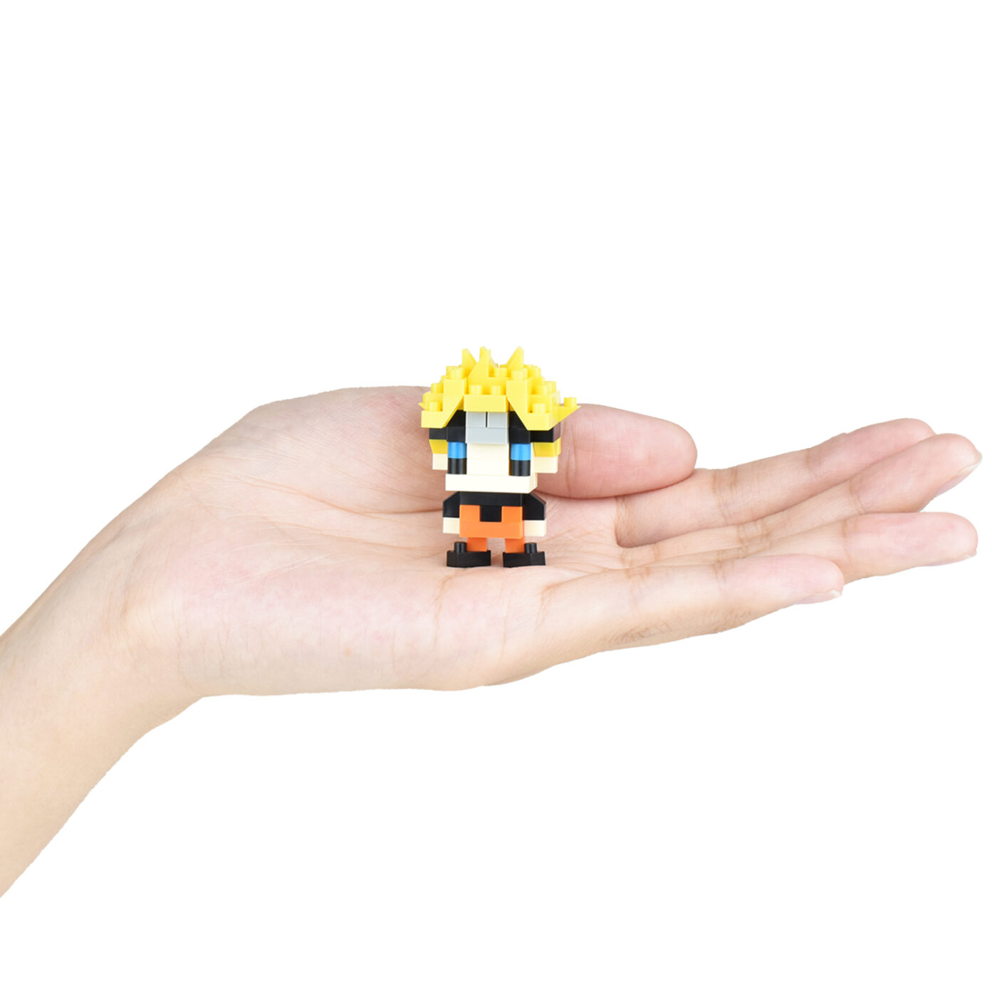 Small Naruto Uzumaki figure displayed on a person's hand